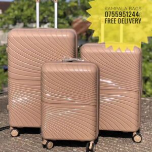 "Variety of stylish suitcases and travel bags on display, showcasing vibrant colors and durable materials, all marked with sale tags for a special discount."