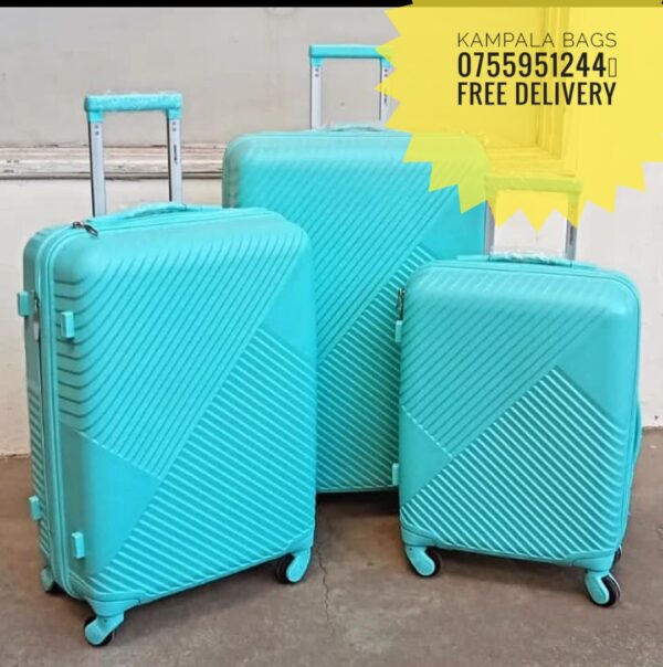 "Variety of stylish suitcases and travel bags on display, showcasing vibrant colors and durable materials, all marked with sale tags for a special discount."