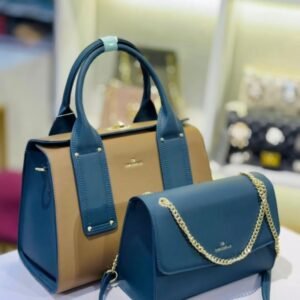 Two stylish handbags displayed: a large tan bag with blue accents and a smaller blue bag with a gold chain strap.